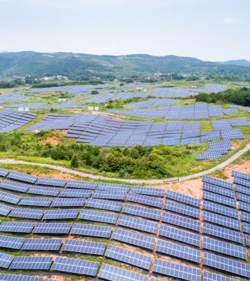 solar power station on hillside, aerial view of renewable energy